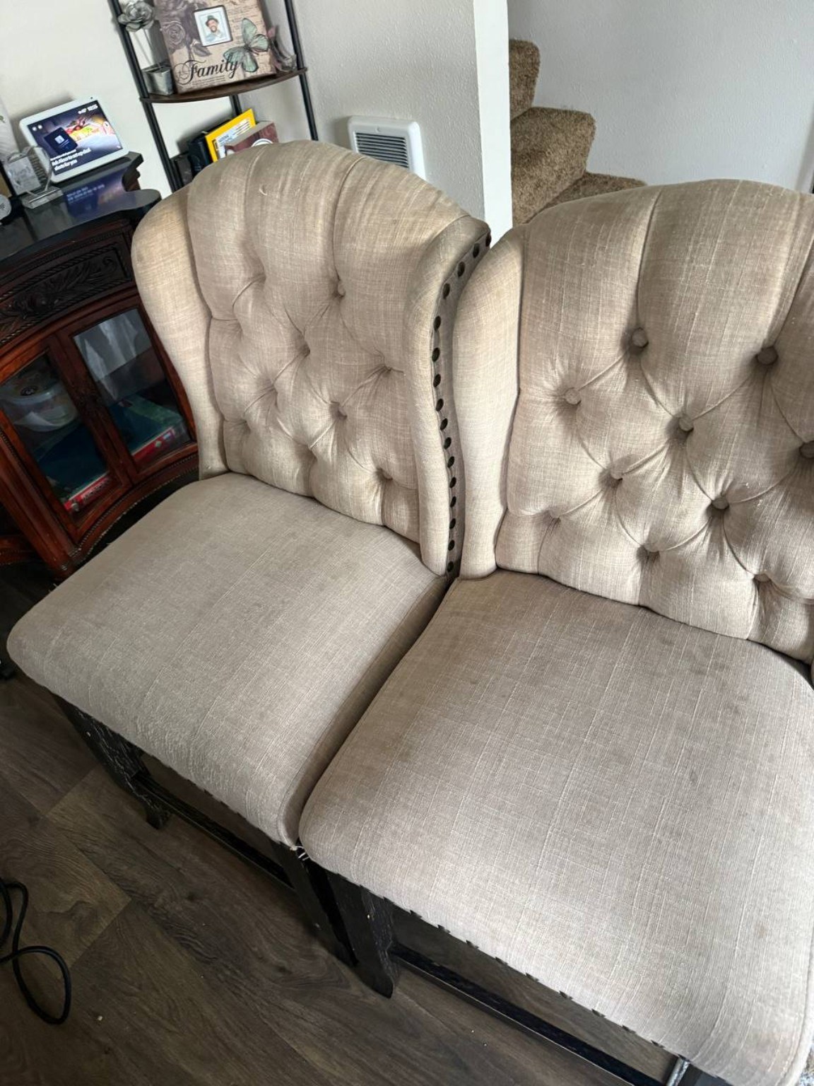Two tufted dining chairs after cleaning